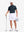 Front full body shot of model wearing navy dry fit waffle textured collared golf shirts