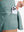 Detail view of inner pocket on dusty blue women's high waisted golf skirts with 4 inner pockets