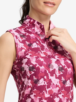Detail view of neck zipper on red splatter women's sleeveless q-zip print quick dry golf tops