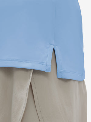 Detail view of hem on light blue women's 4 buttons golf polo shirts