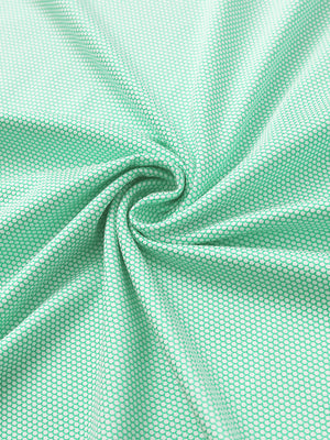 Close-up of ice green performance ananas jacquard polo fabric showing refined texture.