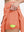 Detail view of inner pocket on peach pink women's moisture-wicking athletic tennis skirts