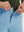 Detail view of the zipper on the light blue stretch soft flat front dress golf shorts, highlighting secure closure