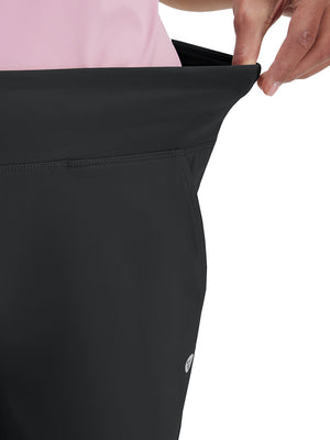 Detail view of waist stretch on black women's high waist stretch golf pants with pockets
