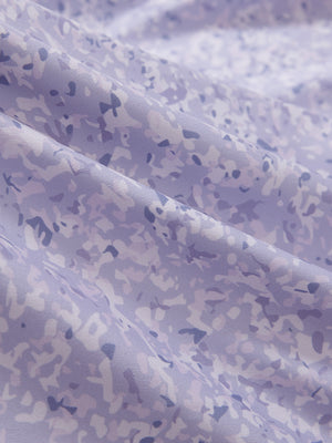 Close-up texture of lavender rose women's sleeveless v-neck print golf shirts fabric showing printed weave detail.