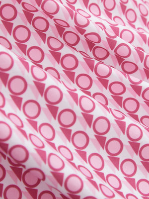 Close-up texture of white pink geometric women's sleeveless v-neck print golf shirts fabric showing printed weave detail.