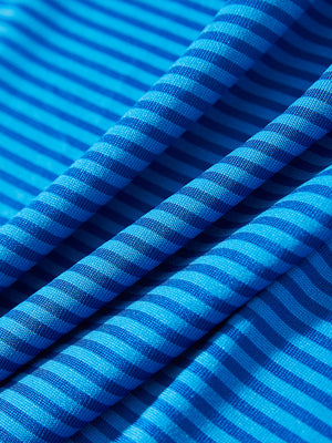 Texture close-up of Kids stripe golf polos with soft fabric and bright cobalt stripe stripes