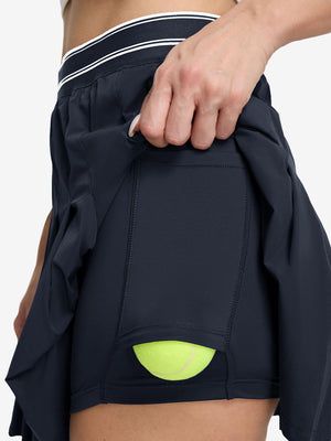 Detail view of inner pocket on navy blue women's moisture-wicking athletic tennis skirts