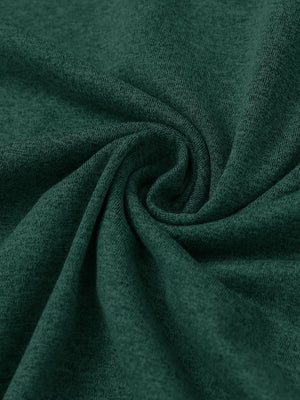 Fabric close-up of quarter zip hoodie with kangaroo pocket, soft texture and cozy feel in turquoise heather