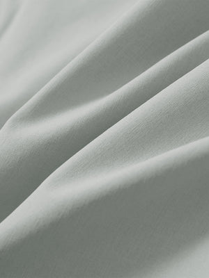 Close-up of light grey stretch quick dry casual golf pants with 4 pockets fabric texture.