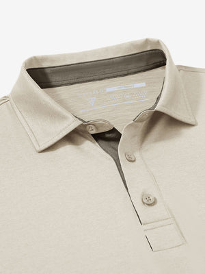 Collar and button detail close-up in light khaki heather of performance heather contrast collar polo shirts.