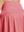 Detail view of back design on pink women's high waisted golf skirts with 4 inner pockets