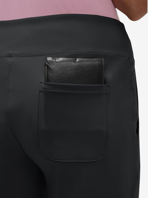 Back view of pocket on black  women's high waist stretch golf pants with pockets