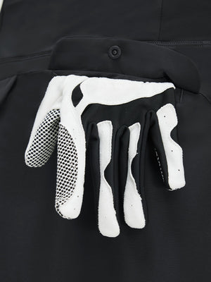 Detail view of pocket on black women's stretch a-line golf skort with 7 pockets