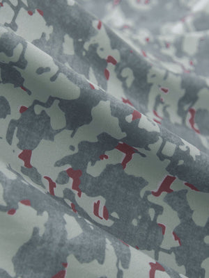 Close-up texture of grey/wine camo premium ribbed collar print polo shirts fabric showing detailed premium material and weave.