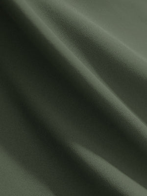 Close-up texture of mossy stone women's 4 buttons golf polo shirts fabric showing detailed knit weave.