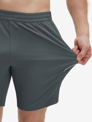 View showing loose fit of dark grey 4 way stretch breathable workout athletic shorts