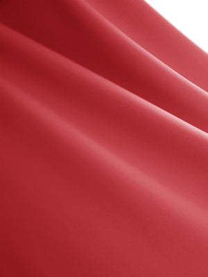 Close-up texture of pink women's high waisted golf skirts with 4 inner pockets fabric showing detailed material and weave.