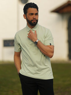 The model is wearing Feather Weight Jacquard Polo Shirts, with one hand resting on the collar