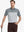 Half-body front shot holding golf club in GREYGLACIER GREY Premium Performance Polo