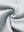 Close-up fabric detail of soft sweatpants with 4 zipper pockets, smooth texture and cozy light grey heather feel
