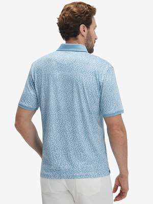 Back upper body shot of model wearing white blue abstract stylish full print contrast collared golf polo shirts