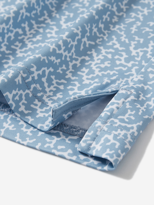 Detail view of hem on white blue abstract stylish full print contrast collared golf polo shirts